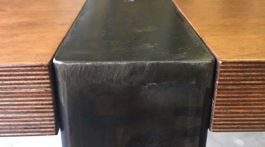 Close up of metal legs of custom table